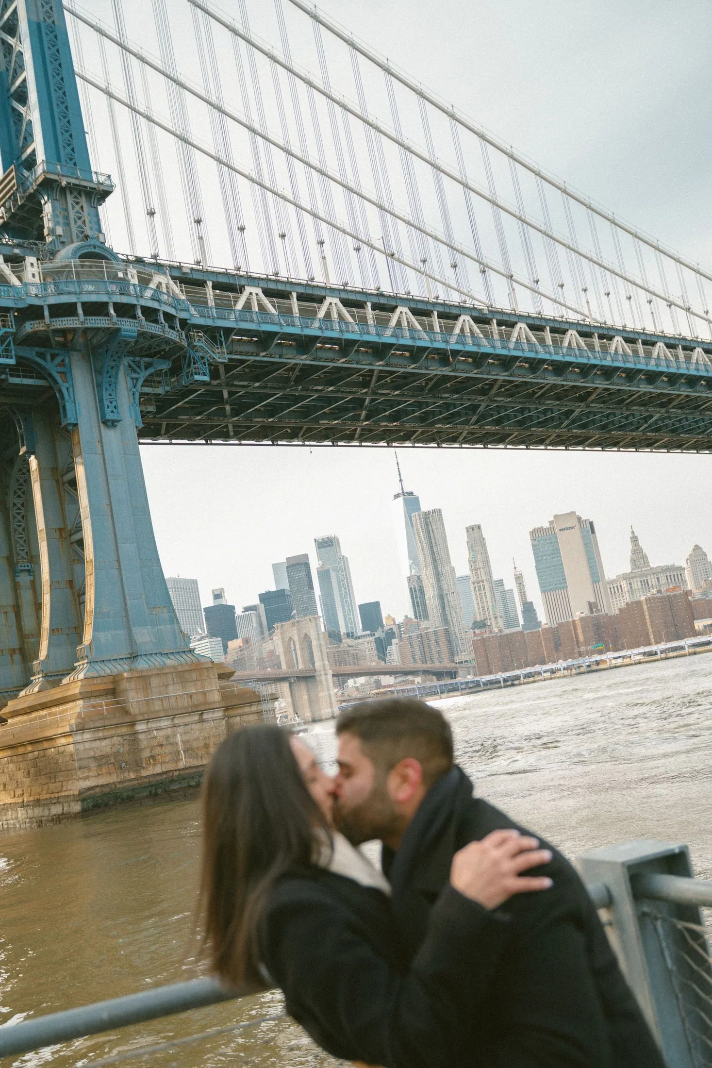Couple portrait beneath the Manhattan Bridge